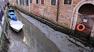 Low tides leave Venice canals dry