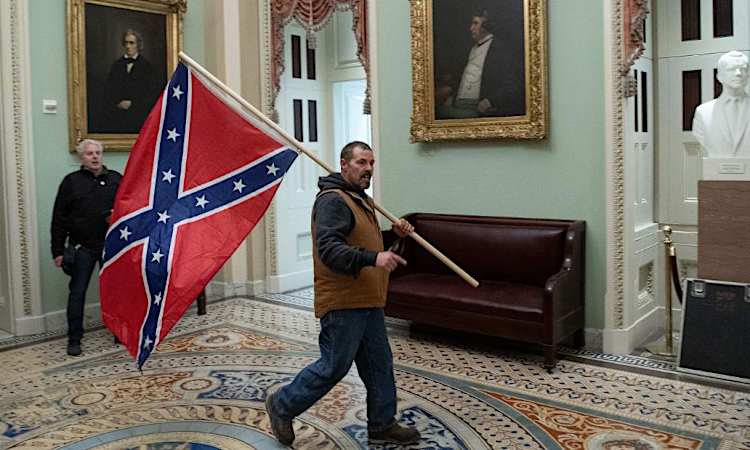 The FBI wants your help in ID'ing the man carrying a Confederate flag inside the US Capitol