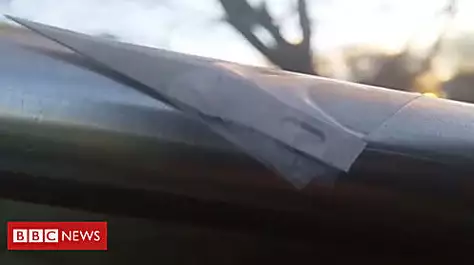 Scalpel blades taped to children's slide