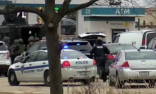 A gunman holding a woman hostage inside an Illinois bank has surrendered