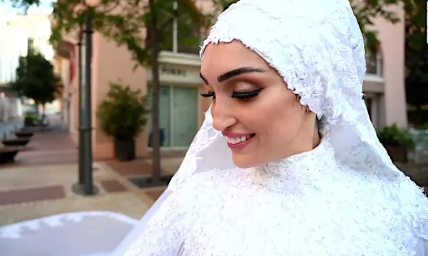 One moment, they were filming the bride in her wedding dress. Then came the explosion