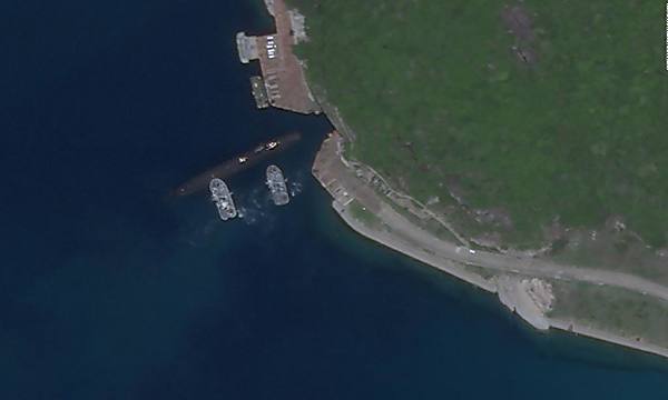Satellite photos appear to show Chinese submarine using underground base