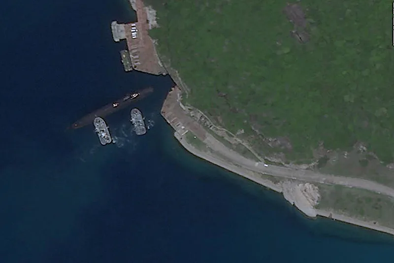 Satellite photos appear to show Chinese submarine using underground base