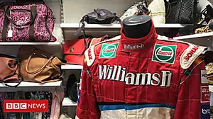 Charity shop given Formula 1 suit