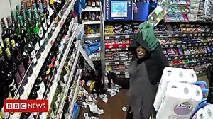 CCTV shows shopkeeper grab gun off robber