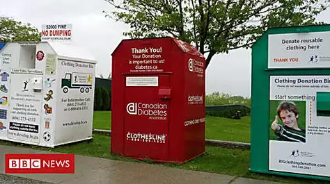Woman dies trapped in clothing donation bin