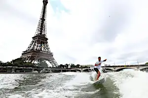 Tahitian surfing champion Kauli Vaast takes victory lap along the Seine