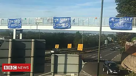 'Sorry James' banners taken down from bridge