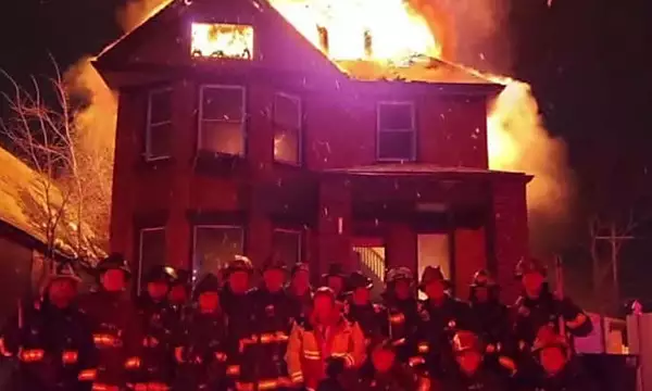 Photo of Detroit firefighters posing in front of burning house will be investigated, commissioner says