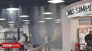 Video captures rain pouring into airport terminal