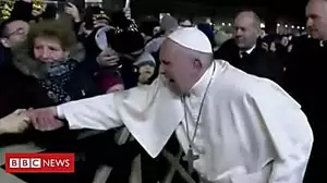 Pope slaps pilgrim's hand after arm yank