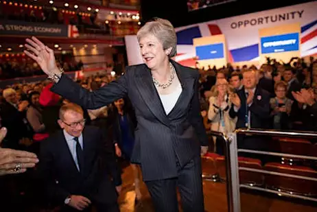 Britain's Theresa May wins political reprieve