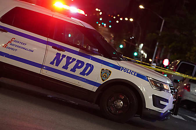 Woman shot in the head as she collected recyclables on Queens street