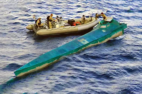 Coast Guard Intercepts Strange Blue Boat. Then They Take A Look Inside!