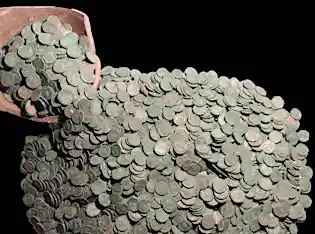 'Biggest ever' treasure trove of Roman coins found in Britain
