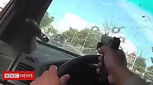 Officer shoots through own windscreen