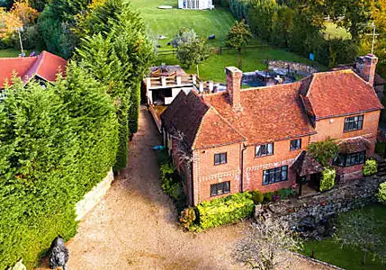 Former U.K. Family Home of Richard Branson Lists in Surrey Village