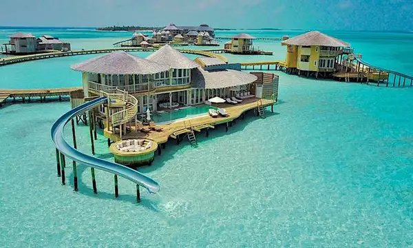 Over-Water Villa in the Maldives With a Private Pool and a Water Slide Into the Indian Ocean