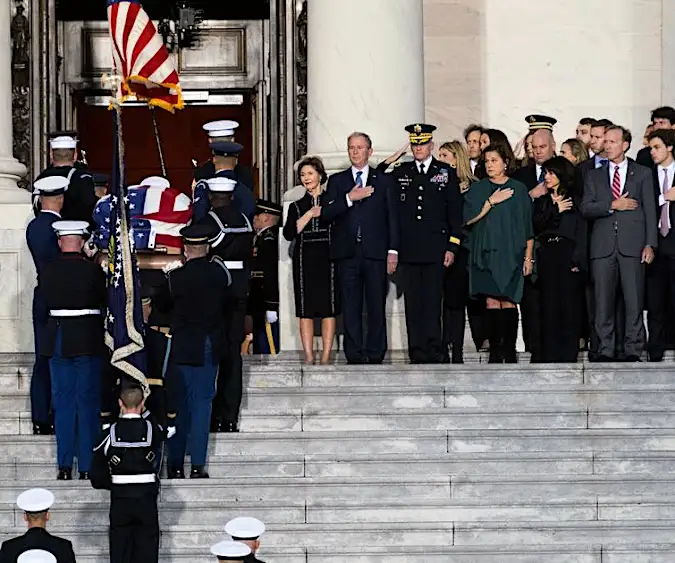 Bush's coffin arrives at Capitol; Trump plans to attend funeral