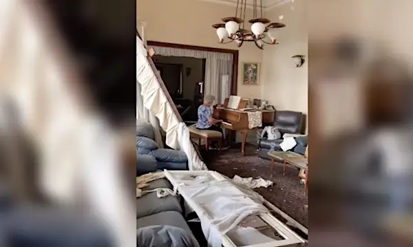 A grandmother played 'Auld Lang Syne' on a piano surrounded by rubble from the Beirut explosion