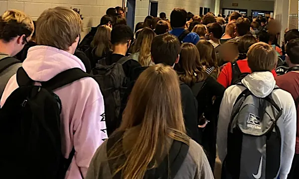 Georgia student who posted photo of a crowded school hallway and called it 'good and necessary trouble' no longer suspended