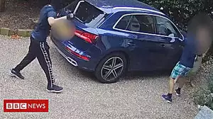 Moment driver fights off three masked men