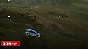 Rally car goes flying down zip wire