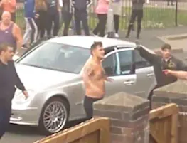 UK CRIME WAVE: Baying mob attack Mercedes driver and passenger in shock footage UK CRIME WAVE: Baying mob attack Mercedes driver and passenger in shock footage