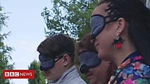 Blind man gives blindfolded tour