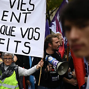 Tens of thousands take to the streets of Paris in protest over cost of living, climate inaction