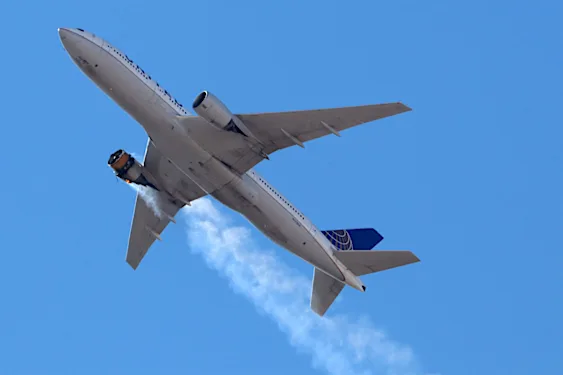 Passengers celebrate as United Airlines flight lands after engine failure