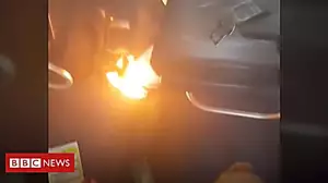 Charging mobile catches fire on plane