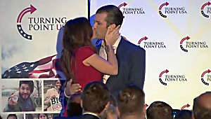 Trump Jr., girlfriend kiss and campaign