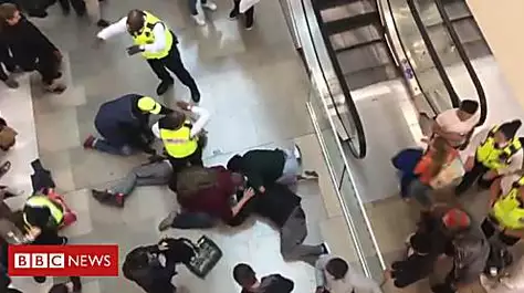Man arrested over shopping centre 'fall'