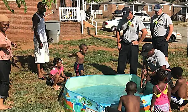 These kids were carrying water in pots to fill up their pool. Then firefighters stopped to help.